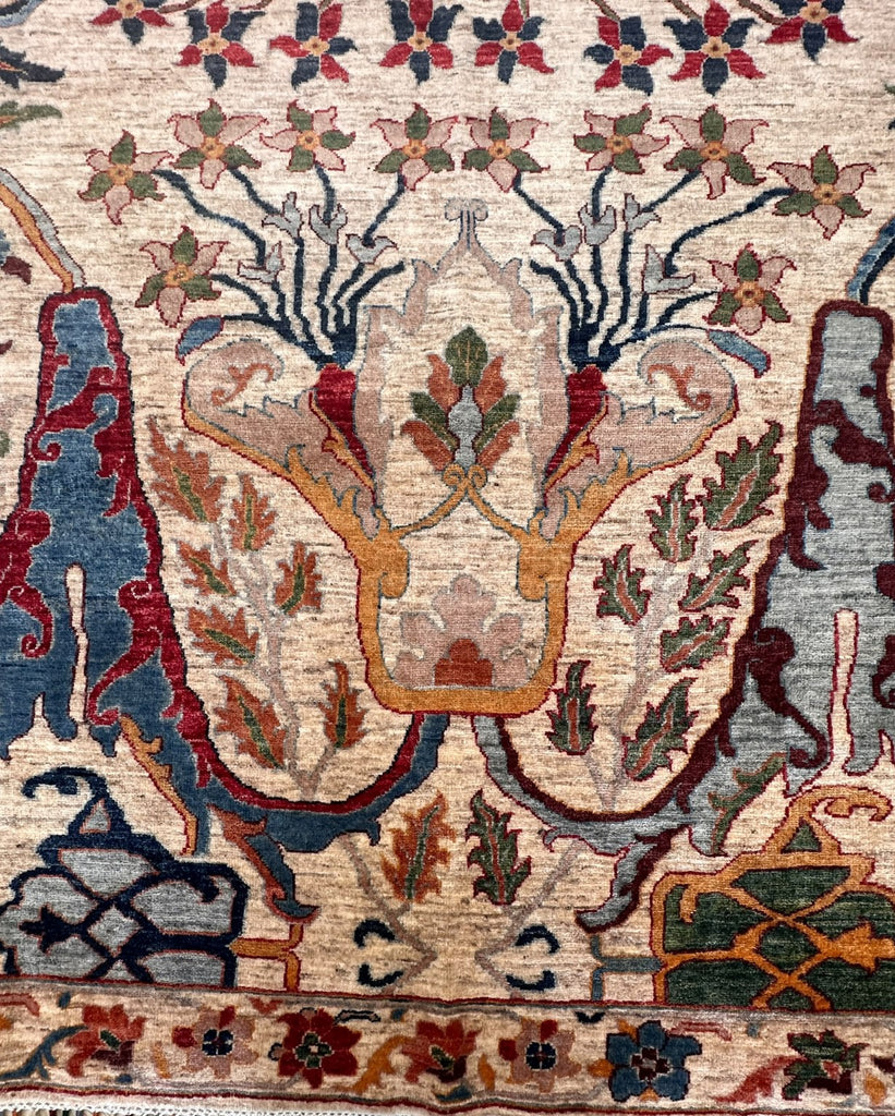 Detail of floral vase motif in ochre, pale blue and burgundy on cream