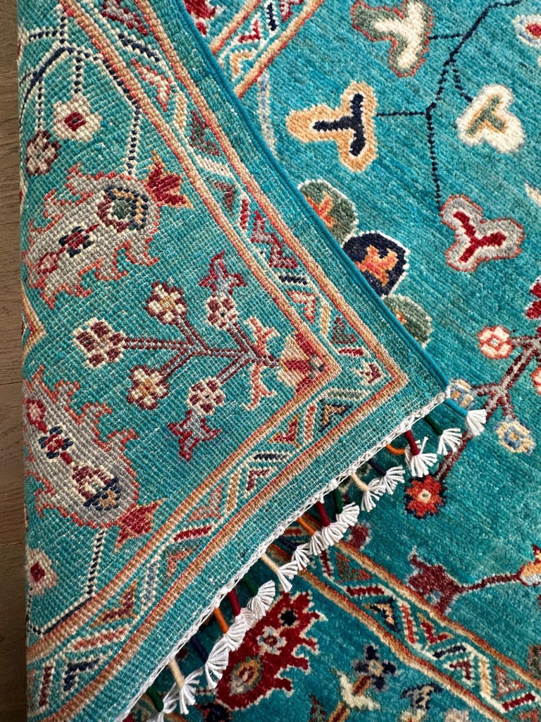 Reverse weave and hand-finished fringe of Afghan Sultani Chobi rug