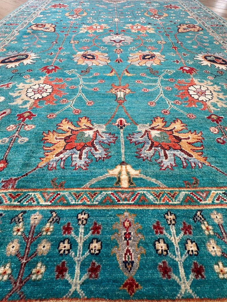 Low angle view showing the hand-knotted wool pile of Afghan Sultani Chobi rug