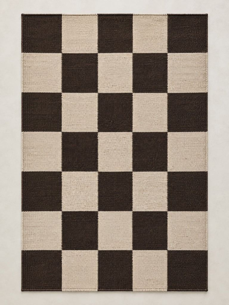 Checkered handmade pure wool rug with dark and ivory squares, full rug view