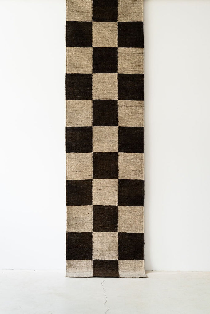Full length view of the anthracite and ivory checkered wool runner