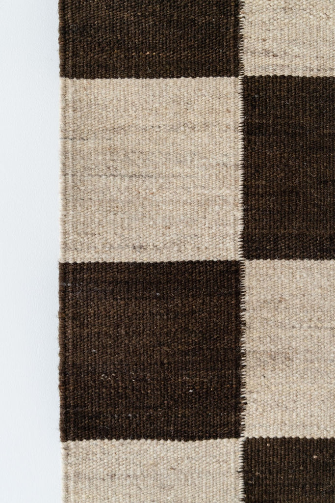Handmade wool texture and checkered pattern detail