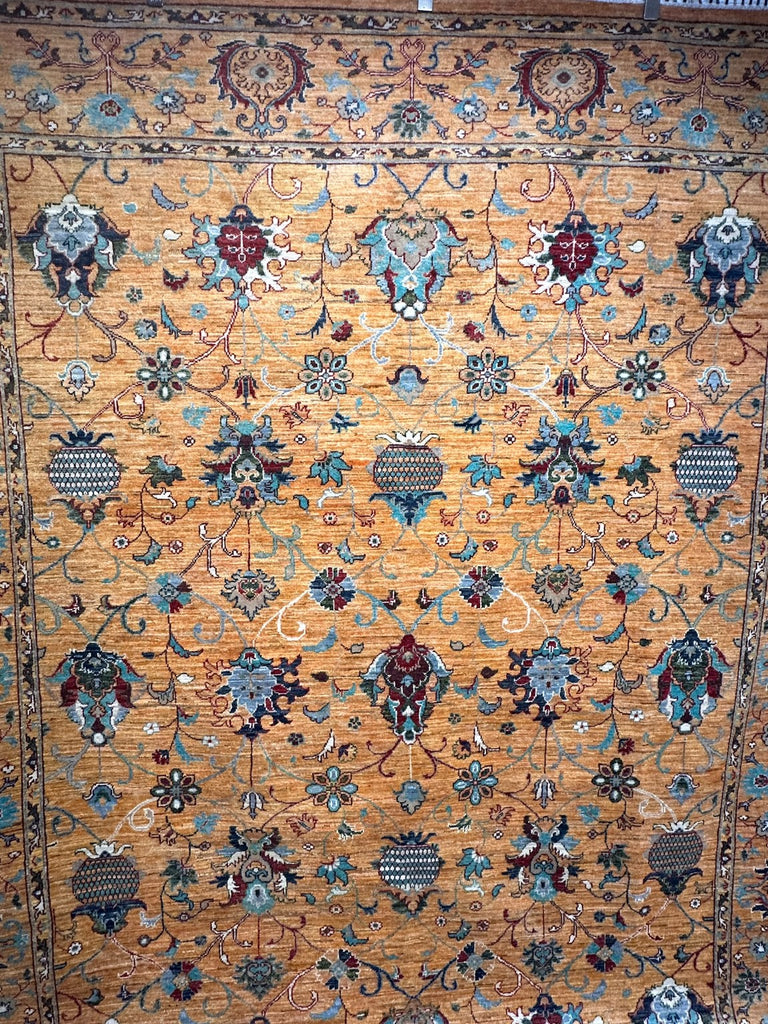 Sultani floral pattern showing palmettes, scrolling vines and turquoise details on a gold field
